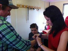 One of our festival volunteers getting wristbanded 