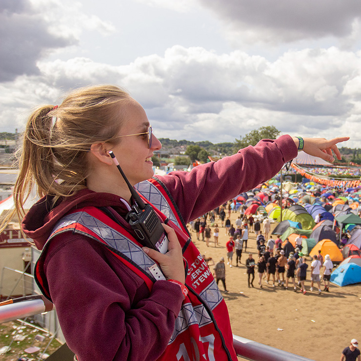 Festival and Event Staff - Hotbox Events - Campsite fire tower staff pointing - 2022-001 740PxSq72Dpi