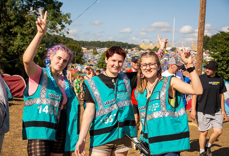 Festival Jobs and Work - Hotbox Events - Campsite marshals smiling with arms raised 2022-001 740x506Px72Dpi