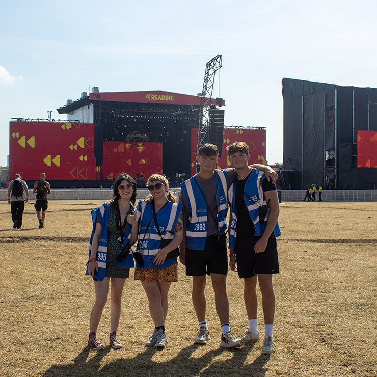 Volunteer at Reading Festival with Hotbox Events - Volunteer group in empty arena with stage - v2023001 740PxSq72Dpi